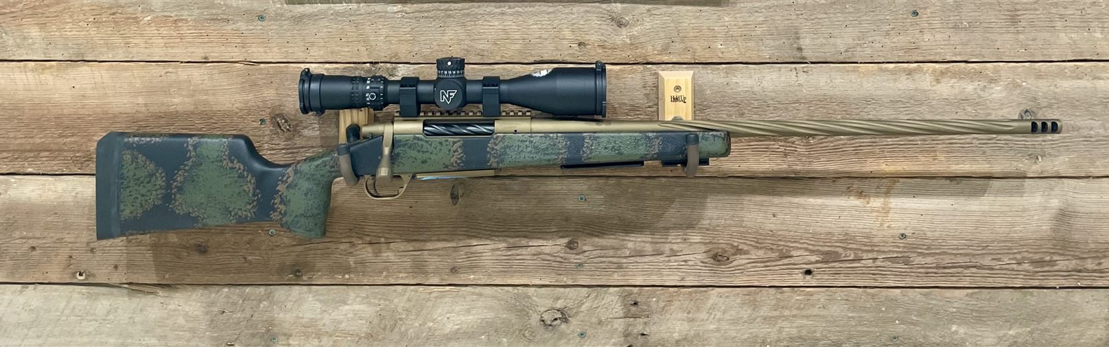 Scoped bolt-action rifle
